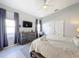 Relaxing bedroom with large bed and grey dresser at 8030 King Palm Cir, Kissimmee, FL 34747