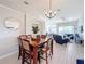 Dining area with a wooden table and view of living room at 8030 King Palm Cir, Kissimmee, FL 34747