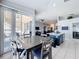 Kitchen features an island and casual dining area with view to backyard at 8030 King Palm Cir, Kissimmee, FL 34747