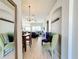 Bright and spacious living room with tiled floor and access to dining area at 8030 King Palm Cir, Kissimmee, FL 34747