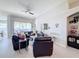 Spacious living room with leather furniture and a view at 8030 King Palm Cir, Kissimmee, FL 34747