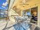 Covered patio with seating area and pool access at 8030 King Palm Cir, Kissimmee, FL 34747