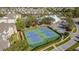 Aerial view of two tennis courts in a residential community at 8030 King Palm Cir, Kissimmee, FL 34747