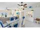 Bright dining area with seating for six and a view into the living room at 830 Hope Ave, New Smyrna Beach, FL 32169