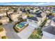 Aerial view of a house with a pool and a large backyard in a residential neighborhood at 9085 Yonath St, Orlando, FL 32827