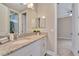 Clean bathroom with granite countertop, white cabinets, and a spacious sink at 9085 Yonath St, Orlando, FL 32827