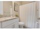 Clean bathroom with a shower/tub combo and granite countertop at 9085 Yonath St, Orlando, FL 32827
