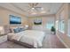 Main bedroom with a king-size bed, and lots of natural light at 9085 Yonath St, Orlando, FL 32827