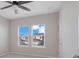 Bright bedroom with ceiling fan and large windows at 9085 Yonath St, Orlando, FL 32827