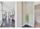 Bright entryway with hardwood floors and a view into the living area at 9085 Yonath St, Orlando, FL 32827