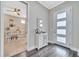 Entryway with a white cabinet, hardwood floors, and an office at 9085 Yonath St, Orlando, FL 32827
