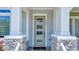 Modern front door with glass panels and a stone entryway at 9085 Yonath St, Orlando, FL 32827
