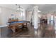 Game room with a pool table, hardwood floors, and a view of the living room at 9085 Yonath St, Orlando, FL 32827