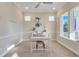 Home office with a desk, large windows, and carpeted floors at 9085 Yonath St, Orlando, FL 32827