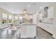 Spacious kitchen boasts a large island, stainless steel appliances, and ample cabinetry at 9085 Yonath St, Orlando, FL 32827