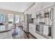 Bright kitchen features stainless steel appliances and white shaker cabinets at 9085 Yonath St, Orlando, FL 32827