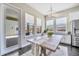 Bright kitchen breakfast nook with French doors leading to backyard at 9085 Yonath St, Orlando, FL 32827