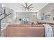 Spacious living room featuring a large sectional sofa and a mounted TV at 9085 Yonath St, Orlando, FL 32827