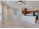 Open living room with kitchen and breakfast bar at 9085 Yonath St, Orlando, FL 32827