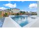 Inviting, rectangular pool with spa and surrounding patio at 9085 Yonath St, Orlando, FL 32827