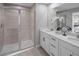 Bathroom features a double vanity, large shower, and modern decor at 9843 Walkway Dr, Orlando, FL 32832