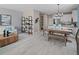 Open concept living and dining area with wood floors and modern decor at 9843 Walkway Dr, Orlando, FL 32832