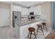 Modern kitchen with white cabinets, gray countertops, and an island at 9843 Walkway Dr, Orlando, FL 32832