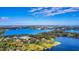Aerial view of lakefront property and surrounding area at 1120 Preserve Point Dr, Winter Park, FL 32789