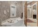 Luxury bathroom featuring a large soaking tub and marble accents at 1120 Preserve Point Dr, Winter Park, FL 32789