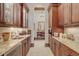 Butlers pantry with granite countertops and ample storage at 1120 Preserve Point Dr, Winter Park, FL 32789