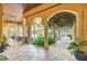 Elegant covered patio with arched columns and tranquil setting at 1120 Preserve Point Dr, Winter Park, FL 32789