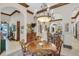 Charming dining area with wood table and chandelier at 1120 Preserve Point Dr, Winter Park, FL 32789