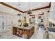 Island kitchen with granite countertops and custom cabinetry at 1120 Preserve Point Dr, Winter Park, FL 32789