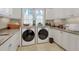 Bright laundry room with granite counters and modern appliances at 1120 Preserve Point Dr, Winter Park, FL 32789
