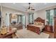 Spacious main bedroom with a large bed, sitting area, and fireplace at 1120 Preserve Point Dr, Winter Park, FL 32789