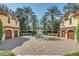 Spacious motor court with fountain and two garages at 1120 Preserve Point Dr, Winter Park, FL 32789