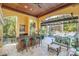 Relaxing patio with bar, seating area, and view of pool at 1120 Preserve Point Dr, Winter Park, FL 32789