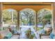 Relaxing covered patio overlooking pool and lush landscape at 1120 Preserve Point Dr, Winter Park, FL 32789