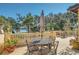 Private patio overlooking lake with seating area at 1120 Preserve Point Dr, Winter Park, FL 32789