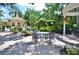 Community patio with tables, chairs, and grill at 1120 Preserve Point Dr, Winter Park, FL 32789