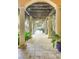 Long covered walkway with columns and lush greenery at 1120 Preserve Point Dr, Winter Park, FL 32789