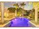 Inviting pool area with lush landscaping and lighting at 1120 Preserve Point Dr, Winter Park, FL 32789