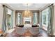 Bright sitting room with fireplace and comfortable seating at 1120 Preserve Point Dr, Winter Park, FL 32789