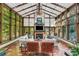 Relaxing sunroom with fireplace and ample natural light at 1120 Preserve Point Dr, Winter Park, FL 32789