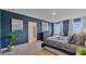 Primary bedroom with blue walls and a king-size bed at 1261 Limbali St, Mount Dora, FL 32757