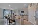 Modern kitchen with island, stainless steel appliances, and pantry at 1261 Limbali St, Mount Dora, FL 32757