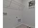 Laundry room with shelving and pet bowls at 1261 Limbali St, Mount Dora, FL 32757