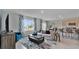 Open living room with kitchen views and ample natural light at 1261 Limbali St, Mount Dora, FL 32757