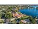 Stunning aerial view showcasing the home's lakefront location and landscaping at 145 Spring Lake Hills Dr, Altamonte Springs, FL 32714