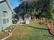 Large backyard with patio and garden at 2122 King Richards Ct, Orange City, FL 32763